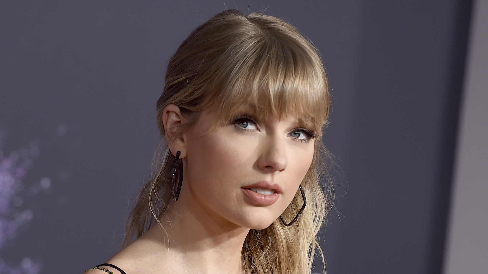 FILE - This Nov. 24, 2019 file photo shows Taylor Swift at the American Music Awards in Los Angeles. Swift was named songwriter of the year at the second annual Apple Music Awards. (Photo by Jordan Strauss/Invision/AP, File)