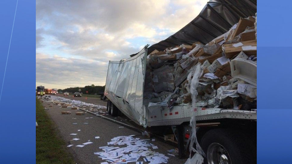 A semi-truck carrying US mail crashed on I-75 Monday morning sending mail across the southbound lanes. (Courtesy of the Florida Highway Patrol)